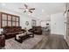 Open concept living area with wood-style floors connects to a modern kitchen at 11580 N 145Th Ave, Surprise, AZ 85379