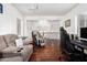 Open floor plan showing the living room with hardwood floors and comfortable seating at 11580 N 145Th Ave, Surprise, AZ 85379