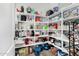 Walk-in pantry with ample shelving for organized storage, offering plenty of space at 11580 N 145Th Ave, Surprise, AZ 85379