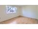 Bedroom features laminate floors, neutral walls and a large window with natural light at 13631 N 103Rd Ave, Sun City, AZ 85351