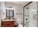 Bathroom featuring a modern vanity, tiled shower, and updated fixtures at 15841 N 23Rd Pl, Phoenix, AZ 85022
