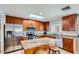 Modern kitchen featuring stainless steel appliances, granite countertops, and ample cabinetry at 15841 N 23Rd Pl, Phoenix, AZ 85022