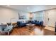 Stylish living room featuring hardwood floors, modern furniture, and bright, neutral decor at 15841 N 23Rd Pl, Phoenix, AZ 85022