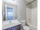 Bathroom features a vanity, mirror, toilet, and combined shower and bathtub at 16077 W Larkspur Dr, Goodyear, AZ 85338