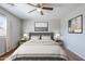 Comfortable bedroom with a large window, and a soft rug creating a tranquil space at 16077 W Larkspur Dr, Goodyear, AZ 85338