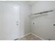 Laundry room features tile flooring, wire shelving and utility connections at 16077 W Larkspur Dr, Goodyear, AZ 85338