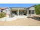 Desert backyard featuring a covered patio and gravel landscaping for low maintenance living at 16527 W Blackhawk Ct, Surprise, AZ 85374