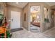 Inviting entryway with tile flooring, leading to the bedrooms and main living area at 16527 W Blackhawk Ct, Surprise, AZ 85374