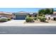Charming single-story home featuring a well-maintained front yard, desert landscaping, and a two-car garage at 16527 W Blackhawk Ct, Surprise, AZ 85374