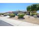 Charming single-story home with well-maintained landscaping and a two-car garage at 16527 W Blackhawk Ct, Surprise, AZ 85374