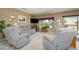 Comfortable living area featuring plush seating, a large window, and ample natural light at 16527 W Blackhawk Ct, Surprise, AZ 85374