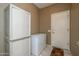 A functional mud room with ample storage cabinets and a convenient freezer at 16527 W Blackhawk Ct, Surprise, AZ 85374