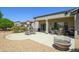 Inviting patio area with comfortable seating and desert landscaping, perfect for relaxation at 16527 W Blackhawk Ct, Surprise, AZ 85374