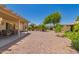 Expansive backyard features desert landscaping, a covered patio, and ample space for outdoor activities and relaxation at 16536 W Rock Springs Ln, Surprise, AZ 85374