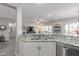 Kitchen with granite countertops, stainless steel appliances, and open floor plan at 16536 W Rock Springs Ln, Surprise, AZ 85374