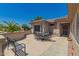 A spacious outdoor patio features a table and chairs perfect for entertaining guests at 16536 W Rock Springs Ln, Surprise, AZ 85374