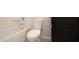 This bathroom boasts a shower-tub combo, modern toilet, and dark vanity at 17419 W Via De Luna Dr, Surprise, AZ 85387