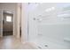 Bathroom showcasing a glass-enclosed shower with tile surround at 17419 W Via De Luna Dr, Surprise, AZ 85387