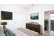 Bedroom includes a dresser, TV, and neutral decor for a calm, inviting space at 17419 W Via De Luna Dr, Surprise, AZ 85387