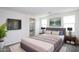 Spacious main bedroom with ensuite bathroom, natural light, and modern décor at 17419 W Via De Luna Dr, Surprise, AZ 85387