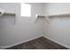 Walk-in closet with neutral carpet, shelving and space for organizing clothes at 17419 W Via De Luna Dr, Surprise, AZ 85387