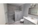 Modern bathroom featuring a tiled walk-in shower, updated fixtures, and a contemporary vanity at 17463 N Del Webb Blvd, Sun City, AZ 85373