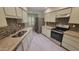 Well-equipped kitchen with modern appliances, stainless steel appliances, granite countertops and ample cabinet space at 17463 N Del Webb Blvd, Sun City, AZ 85373