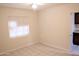 Comfortable bedroom featuring tile floors and a window, providing a relaxing atmosphere at 1914 W Colter St, Phoenix, AZ 85015