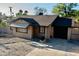 Cozy single-story home with a classic design, showcasing a private entrance and attached garage at 1914 W Colter St, Phoenix, AZ 85015