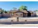 Charming single-story home featuring a well-maintained yard and classic architectural details at 1914 W Colter St, Phoenix, AZ 85015