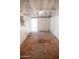 Spacious garage featuring tile flooring and ample natural light creates a flexible, usable area at 1914 W Colter St, Phoenix, AZ 85015