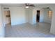 Bright living room with tile flooring, a ceiling fan, and open access to other spaces at 1914 W Colter St, Phoenix, AZ 85015