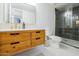 Stylish bathroom features a modern vanity, toilet, and glass shower at 1942 S Emerson -- # 211, Mesa, AZ 85210