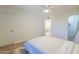 Bright bedroom showcasing hardwood floors, and a view into the ensuite bathroom at 1942 S Emerson -- # 211, Mesa, AZ 85210