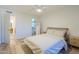 Bright bedroom showcasing hardwood floors, and a view into the walk in closet at 1942 S Emerson -- # 211, Mesa, AZ 85210