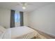 Bright bedroom featuring hardwood floors, a ceiling fan and large window at 1942 S Emerson -- # 211, Mesa, AZ 85210