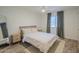 Bright bedroom showcasing hardwood floors, a ceiling fan and a mirror at 1942 S Emerson -- # 211, Mesa, AZ 85210