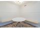 Charming breakfast nook area featuring an accent wall, a round table, and built-in bench seating at 1942 S Emerson -- # 211, Mesa, AZ 85210
