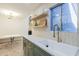 A kitchen space with a dining nook that showcases modern features such as floating shelves and sleek countertops at 1942 S Emerson -- # 211, Mesa, AZ 85210
