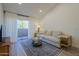 Bright living room with a sliding door, natural light, and neutral tones that offer a serene and inviting atmosphere at 1942 S Emerson -- # 211, Mesa, AZ 85210