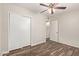 Bedroom featuring wood-look floors, closet with sliding doors, and a ceiling fan at 2022 E Mulberry Dr, Phoenix, AZ 85016