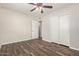 Bedroom featuring wood-look floors, closet with sliding doors, and a ceiling fan at 2022 E Mulberry Dr, Phoenix, AZ 85016