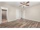 Comfortable bedroom boasts wood-look flooring, ceiling fan, and ensuite bathroom at 2022 E Mulberry Dr, Phoenix, AZ 85016