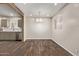 Dining room with hardwood flooring, a chandelier, and kitchen views through a wooden beam at 2022 E Mulberry Dr, Phoenix, AZ 85016