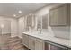 Charming kitchen featuring white countertops, shaker cabinets, and stainless steel dishwasher at 2022 E Mulberry Dr, Phoenix, AZ 85016