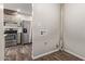 Laundry area with hookups, tile flooring, and view into kitchen at 2022 E Mulberry Dr, Phoenix, AZ 85016