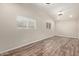 Spacious living room with natural light and wood-look flooring offers a welcoming atmosphere at 2022 E Mulberry Dr, Phoenix, AZ 85016