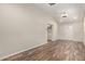 Bright living room featuring stylish wood-look flooring, neutral walls, and ample natural light at 2022 E Mulberry Dr, Phoenix, AZ 85016