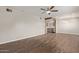Open living room flowing into the kitchen, featuring hardwood floors and a ceiling fan at 2022 E Mulberry Dr, Phoenix, AZ 85016