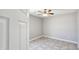 Tile floor bedroom featuring a ceiling fan in a neutral setting at 20427 W Mountain Sage Dr, Buckeye, AZ 85326